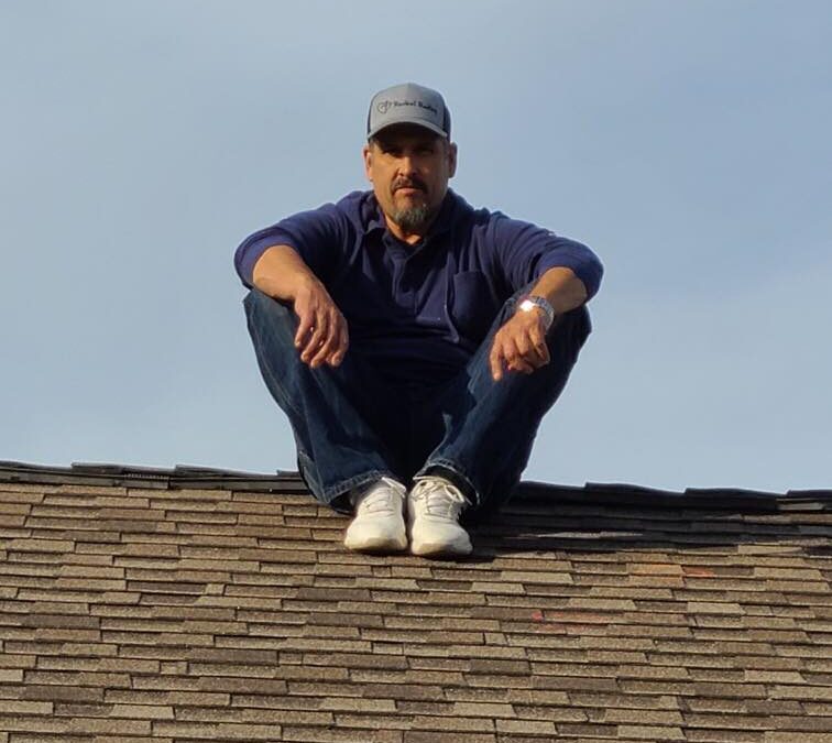 Robert on roof to do a roof inspection