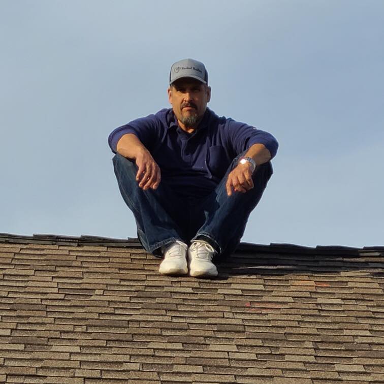 Robert on roof to do a roof inspection