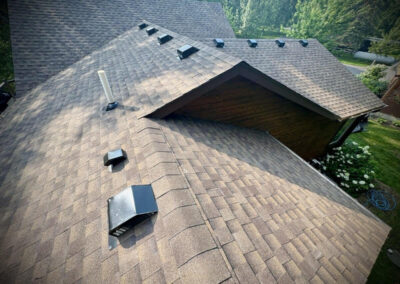 Asphalt roof replacement completed on Brainerd Lakes area home with brown shingles