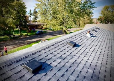 Residential roof completed with gray architectural asphalt shingles