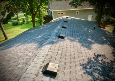 Residential roof completed with gray architectural asphalt shingles