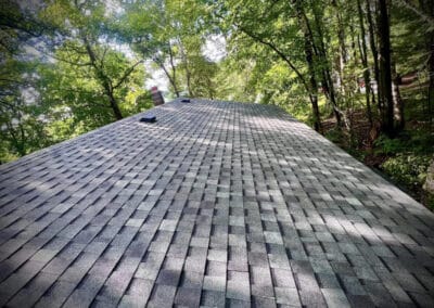 Residential roof completed with gray asphalt shingles