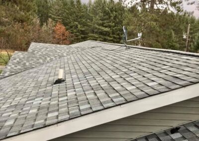 Asphalt roof replacement completed with multi gray shingles