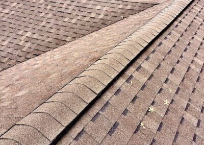 Architectural asphalt roof replacement with red shingles