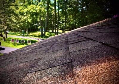 architectural asphalt-roof replacement completed with red shingles closeup view