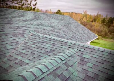 Asphalt roof replacement for home in Brainerd Lakes area with green shingles