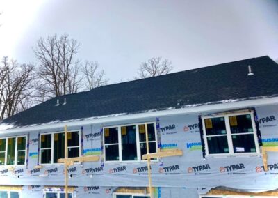 Residential asphalt shingles roof replacement completed with dark gray shingles