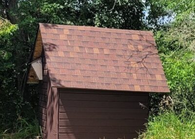 Asphalt shingles roof repair project completed for residential shed