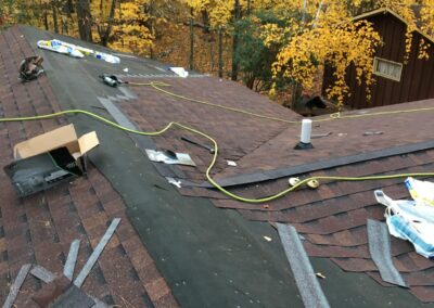 Architectural asphalt shingles roof replacement work on residential home in progress