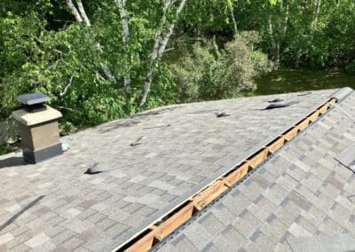 Asphalt shingles roof work in progress for attic ventilation