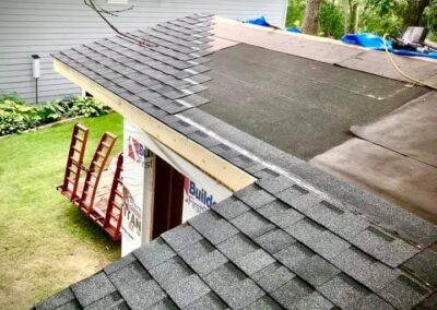 Architectural asphalt shingles roof replacement job in progress showing underlayment