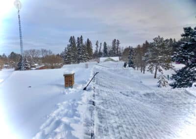 Deep snow on shingles roof in Brainerd Lakes area