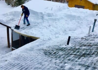 Roof snow removal in progress in Brainerd Lakes area