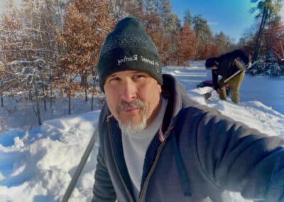 Roof snow removal in progress with Robert