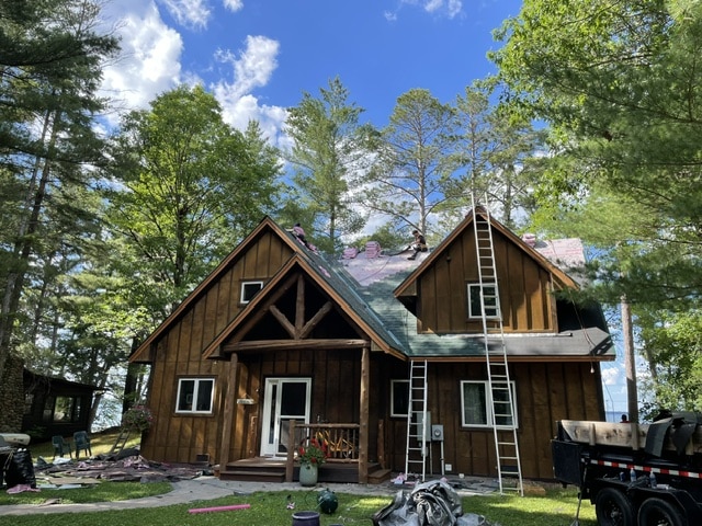 Residential asphalt shingles roof replacement work in progress in Hackensack MN front view
