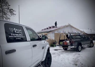 Asphalt shingles roof replacement in progress in Winter
