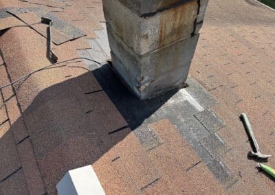 Chimney flashing roof repair board in progress on home in Crosby MN image 1