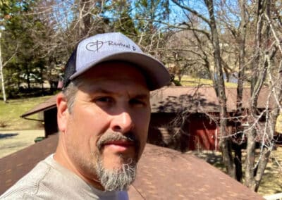 Robert Aguirre working on roof replacement project