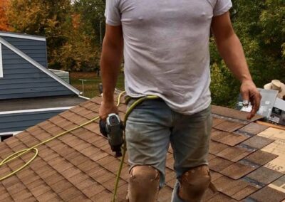 Robert Aguirre working on roof replacement project